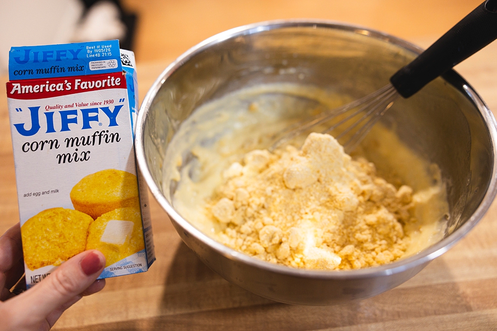 Ingredients for the easiest Jiffy corn muffin mix hack including Jiffy mix, sour cream, creamed corn, and melted butter.