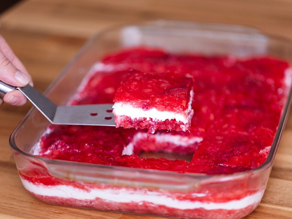 This creamy strawberry jello salad with frozen strawberries, pineapple, and a sour cream layer is a nostalgic, easy dessert perfect for potlucks and holidays.