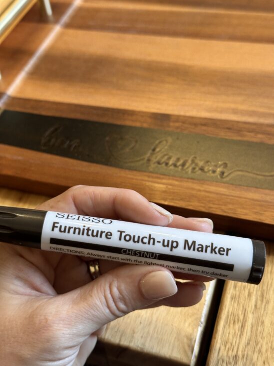 Personalized wooden charcuterie board with custom names created using a Cricut stencil, Applying a removable vinyl stencil to a wooden charcuterie board for a personalized gfit, How to make a personalized charcuterie board without engraving!