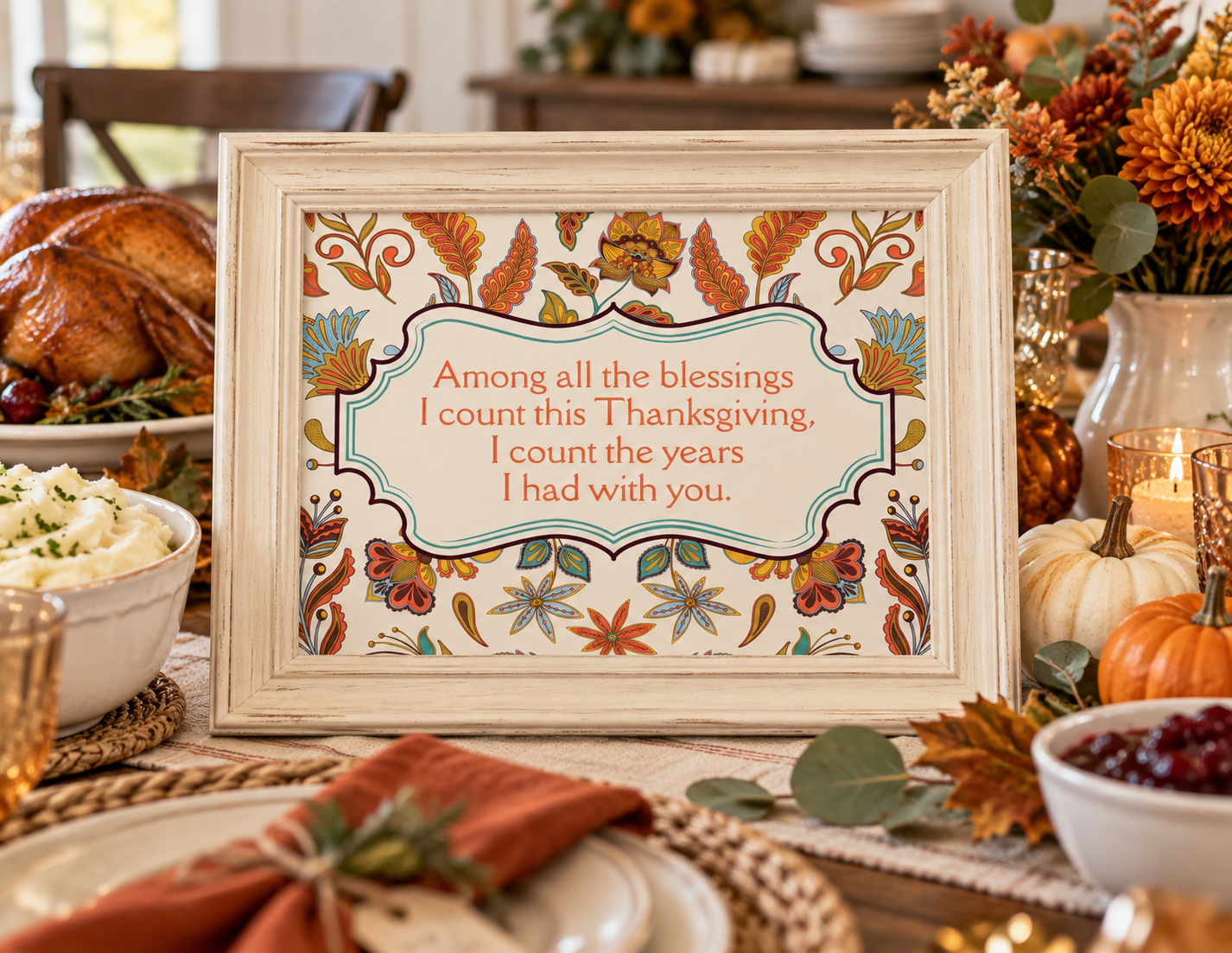 Thanksgiving remembrance printable displayed in a cream frame alongside a festive Thanksgiving dinner table.